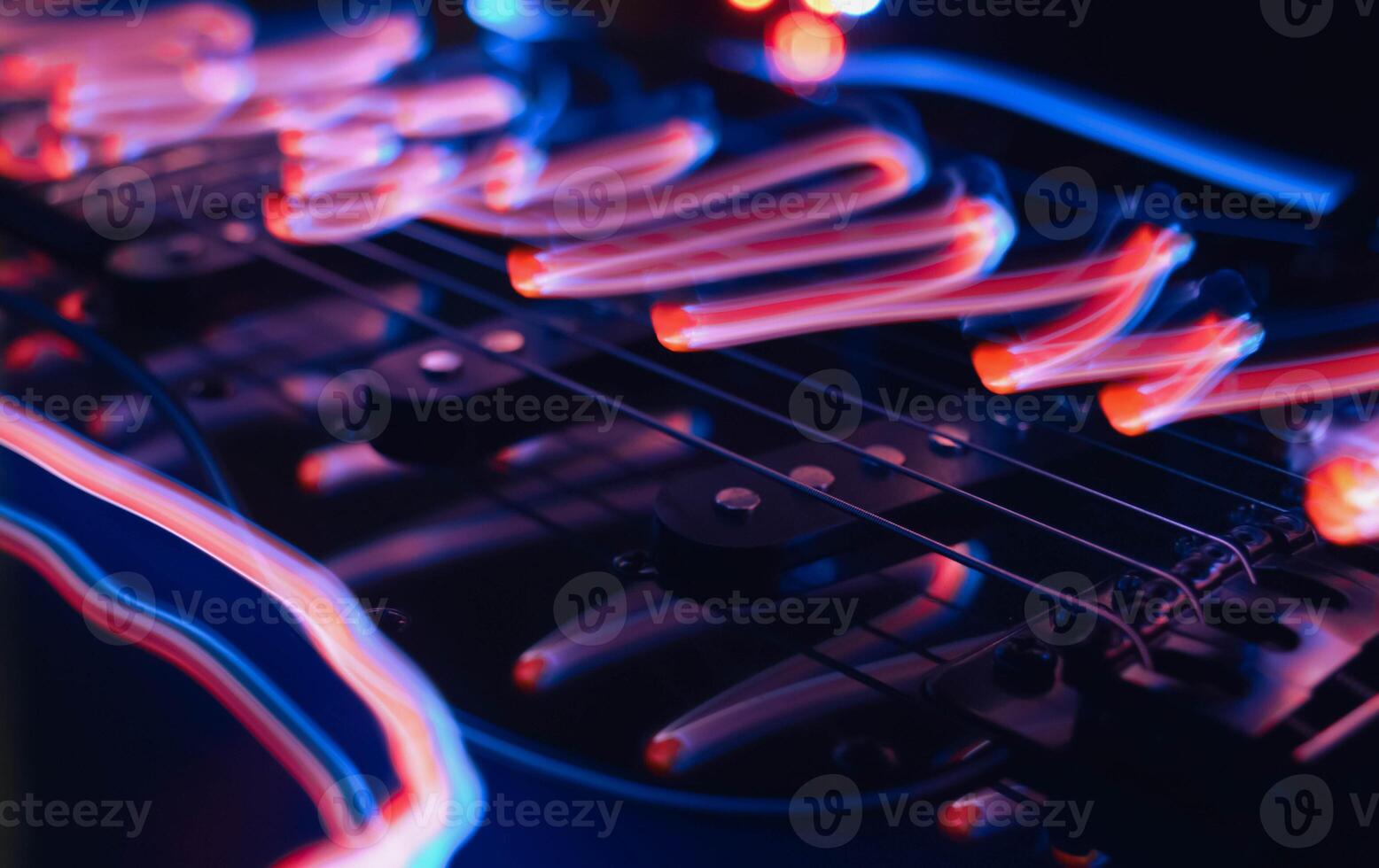 Abstract photo of an electric guitar and its parts macro photo. Music wallpaper and banner for string music album. High quality photo guitar in dark with light reflected in the lacquered surface.