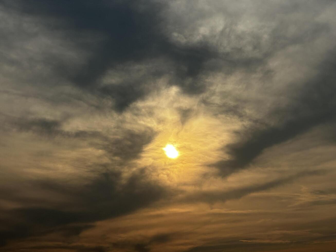 Fiery Sunset over a Silhouetted Landscape photo