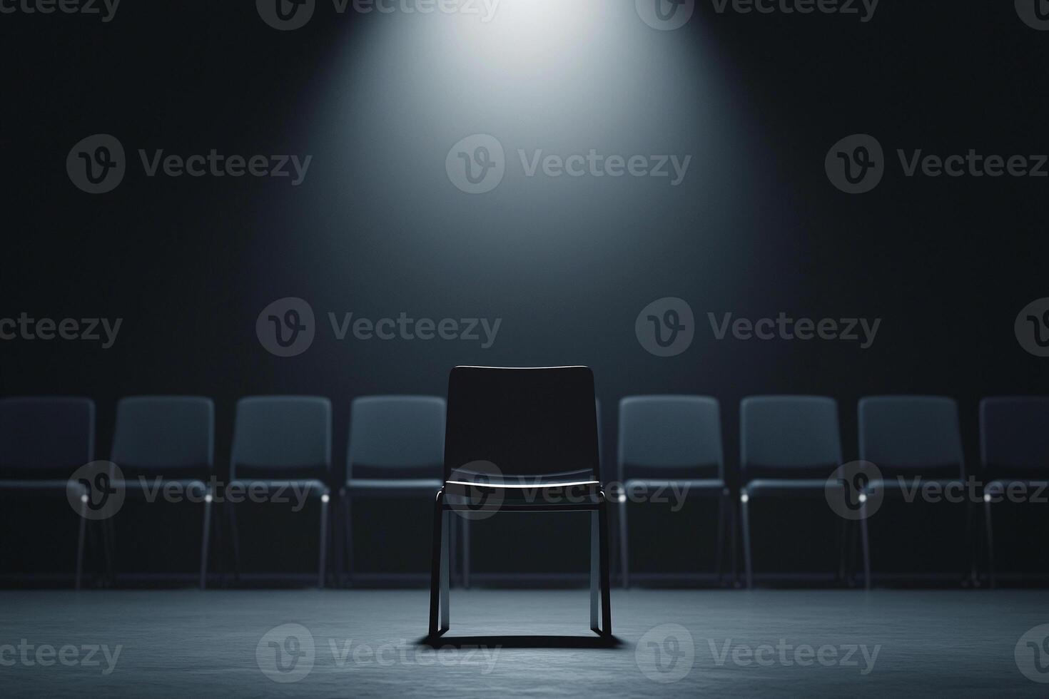 Chair in the spotlight with empty chairs in the background photo