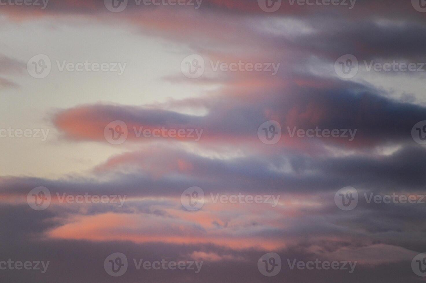A beautiful sunset featuring a significant amount of clouds in the sky photo