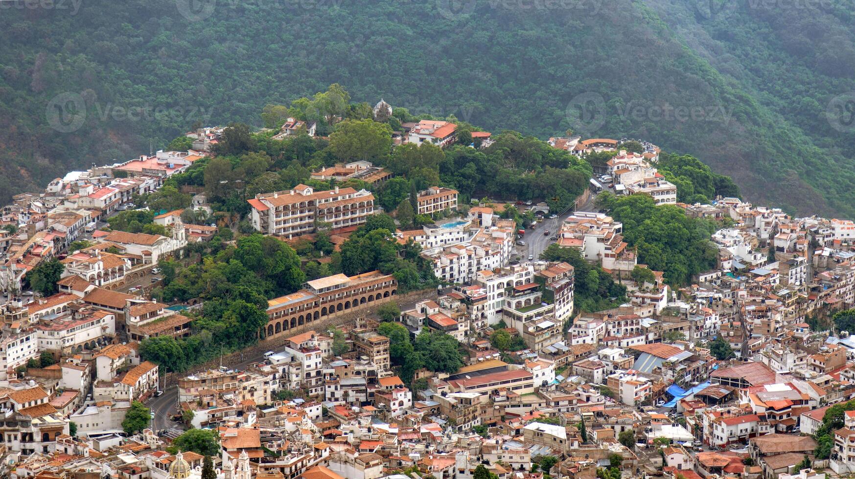 Beautiful view of the hillside town of Taxco de Alarcon in Mexico during a cloudy day photo