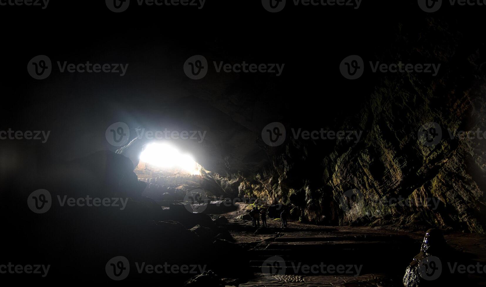 Stunning light entering the Cacahuamilpa Caves highlights natural rock formations photo