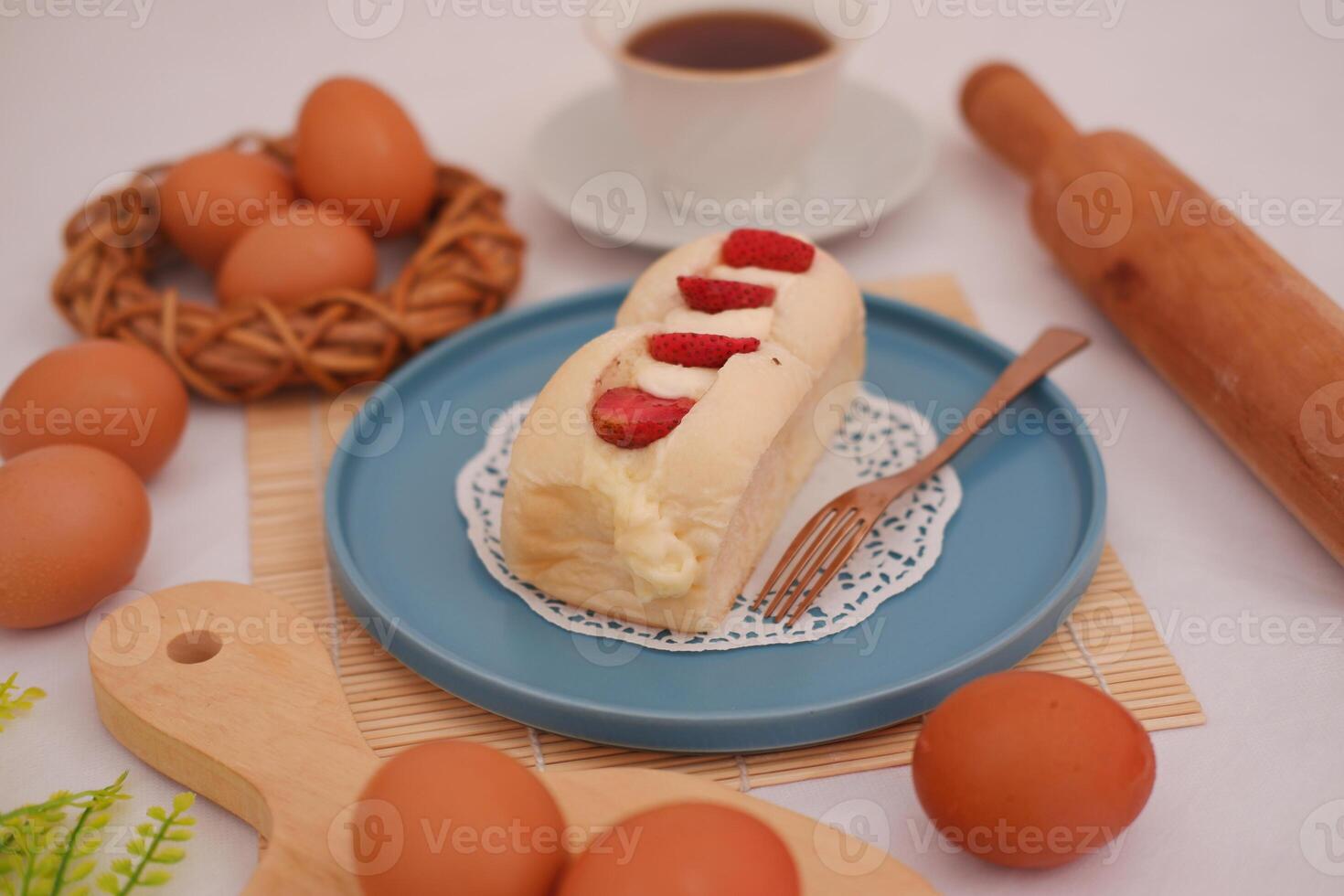 Strawberry cheese cake with cup of coffee on a table. photo