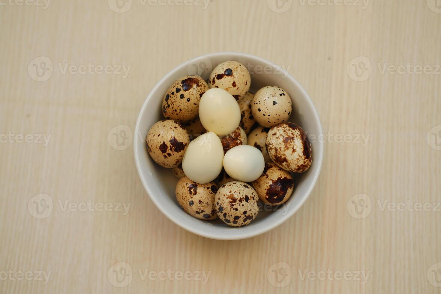 Quail eggs on a wooden table. Close-up, selective focus photo