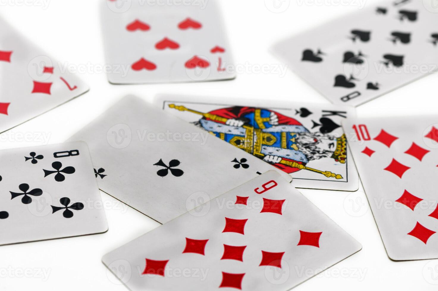 Exploring strategy and chance with a vibrant deck of cards scattered creatively on a surface photo