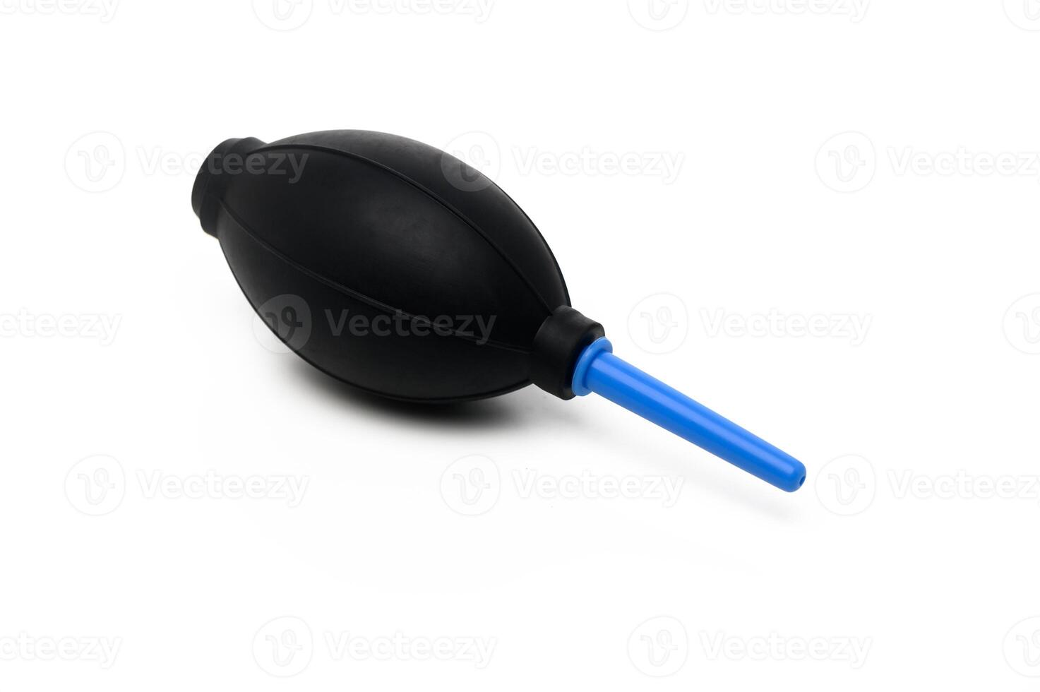 Air blower for lens cleaning in an organized workspace with various tools nearby photo