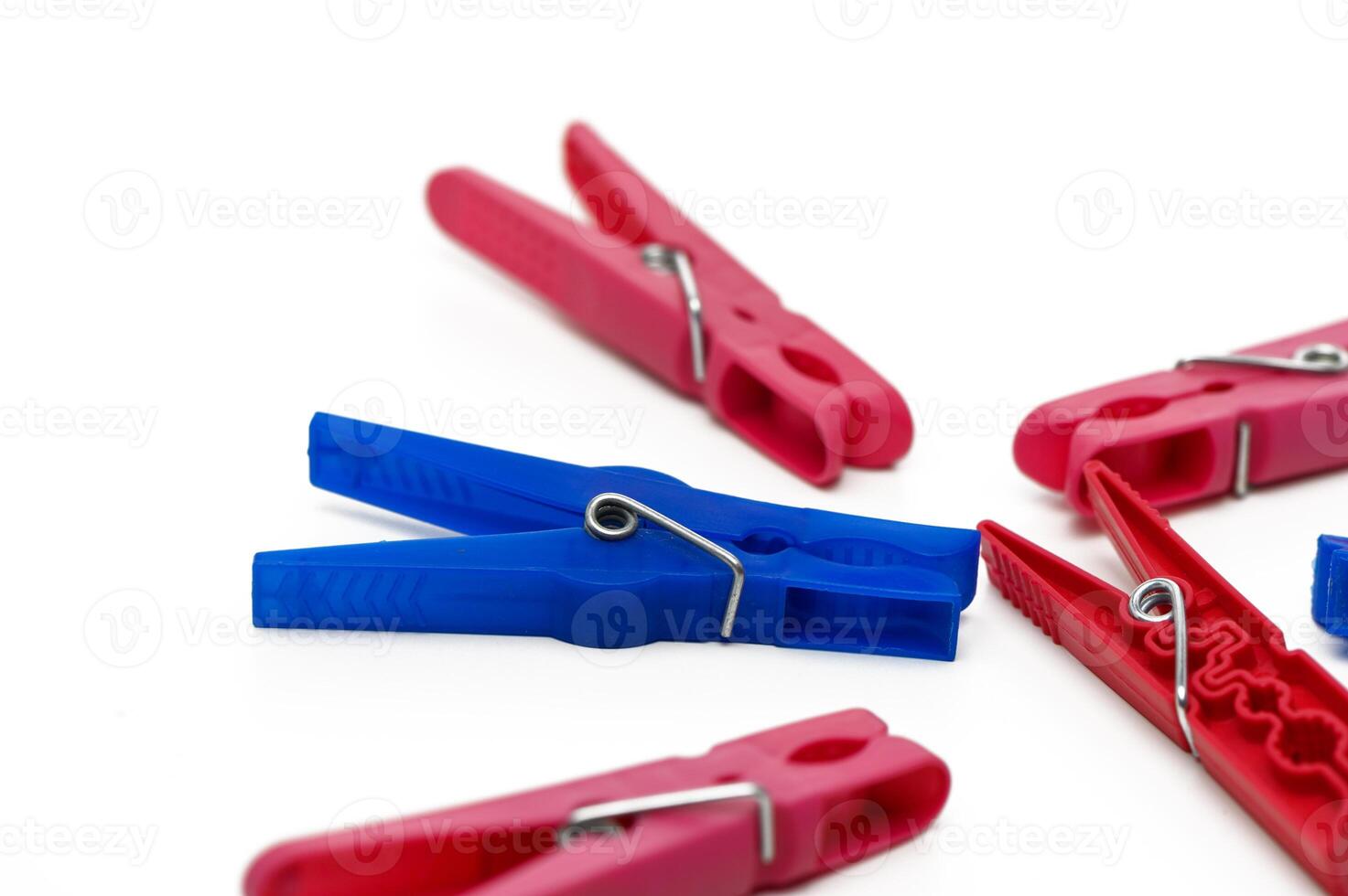 Colorful clothespins arranged creatively on a white background for artistic inspiration and DIY projects photo