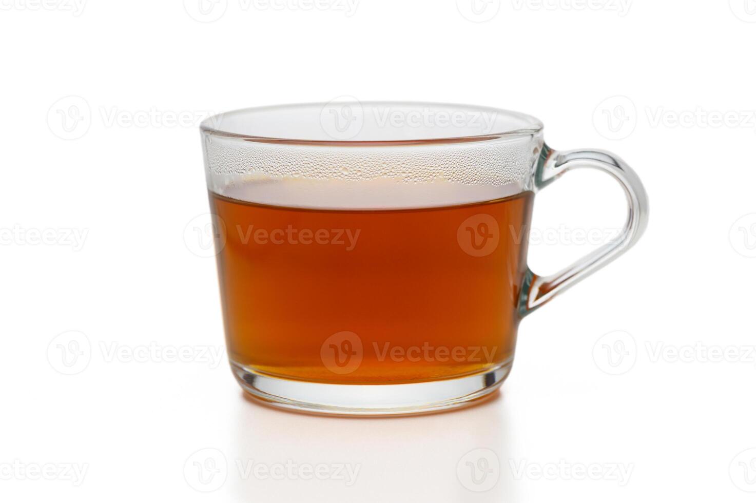 Warm beverage displayed in a clear glass mug on a minimalist background photo