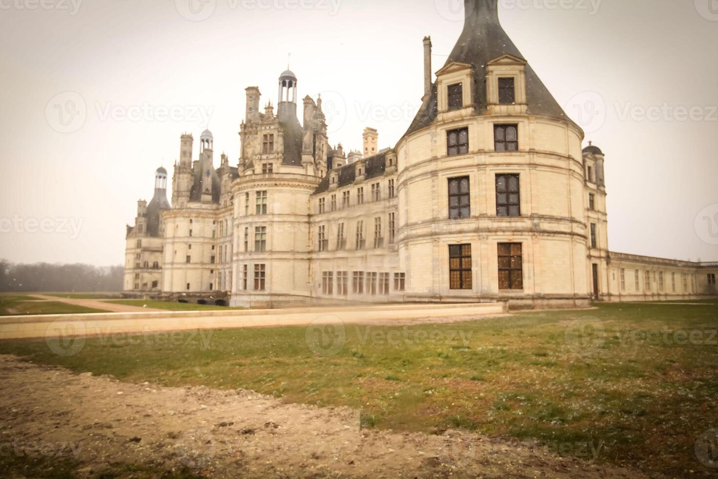 stunning vintage premise stands grandly with its intricate architecture, surrounded by lush greenery under a misty sky, exudes elegance and captures the beauty of timeless architecture photo