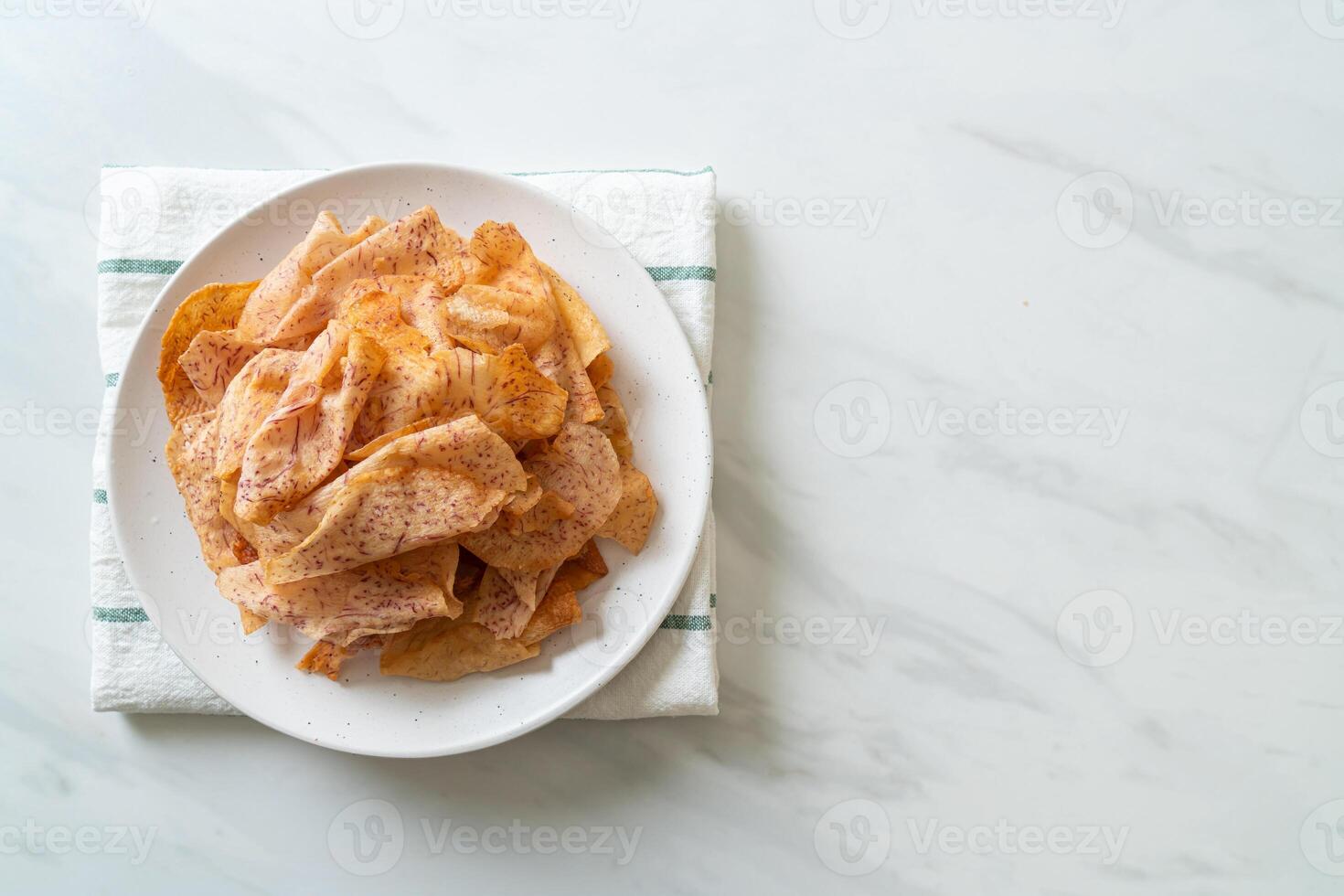 Taro Chips - fried or baked sliced taro photo