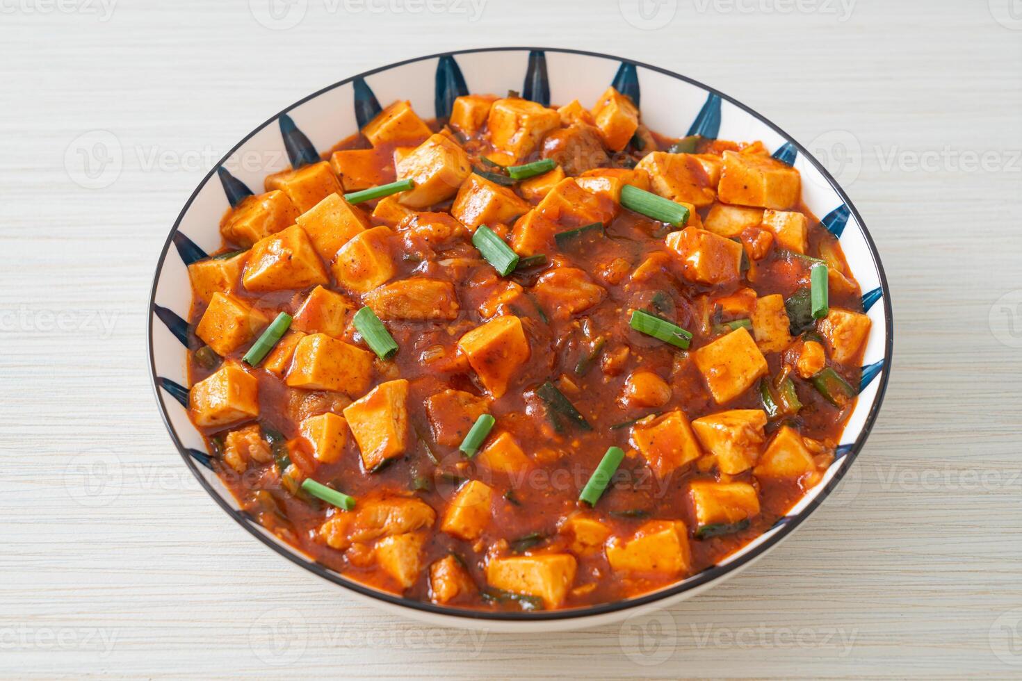 Mapo Tofu - The traditional Sichuan dish of silken tofu and ground beef, packed with mala flavor from chili oil and Sichuan peppercorns. photo