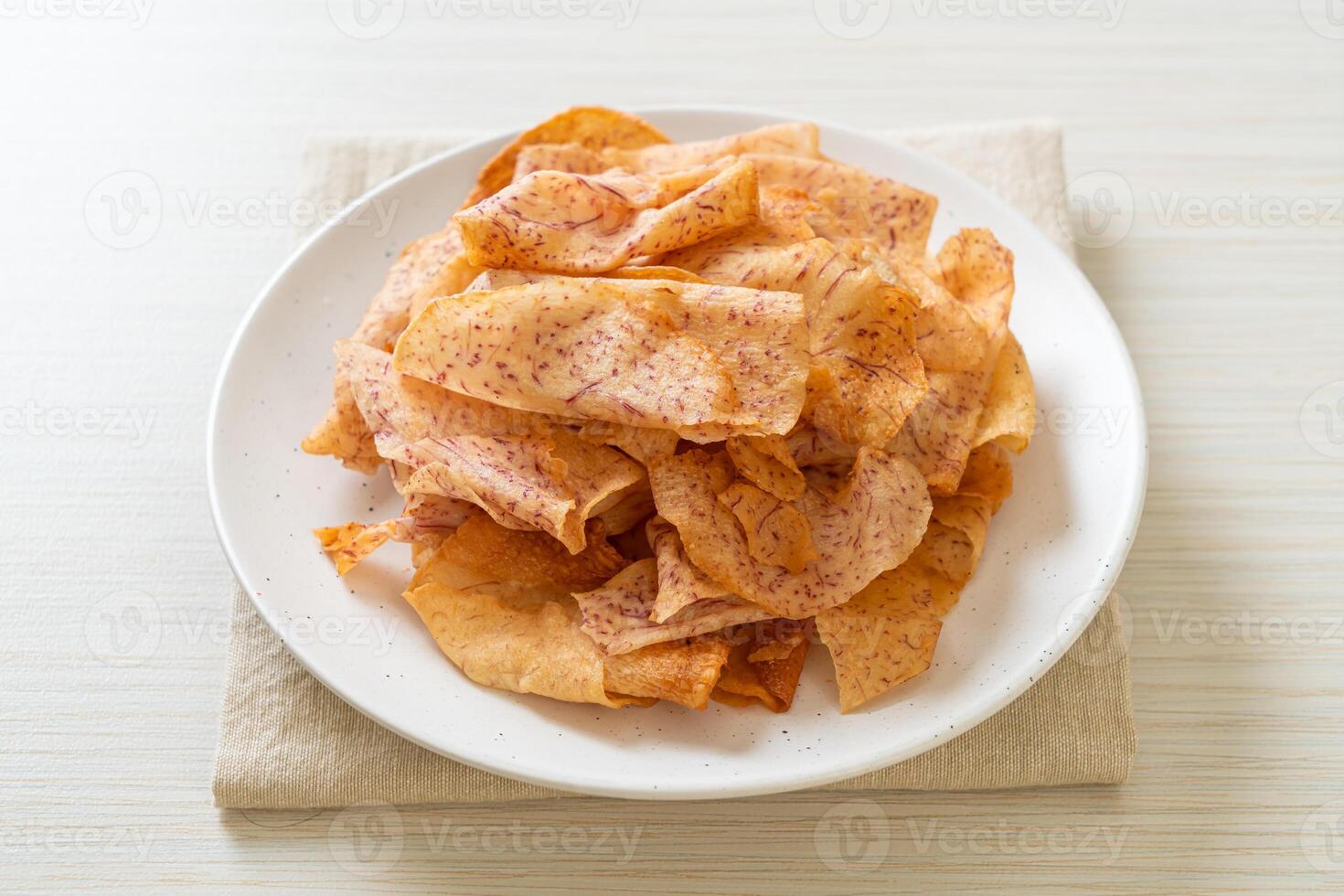 Taro Chips - fried or baked sliced taro photo
