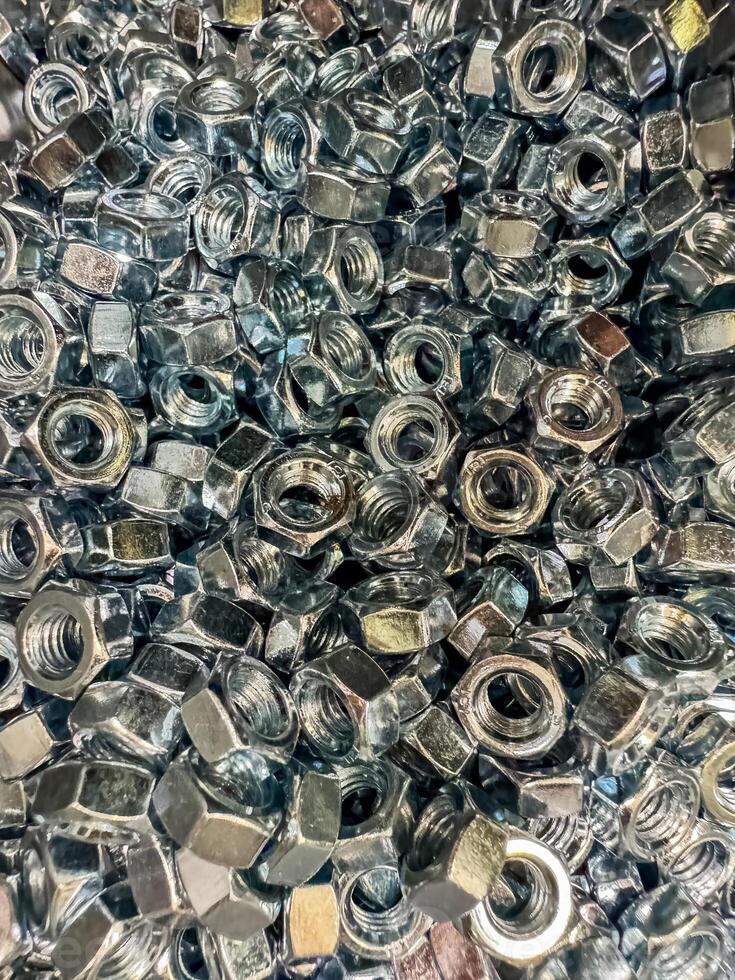 Metal nuts background. Working tools. Fixing elements. High quality photo