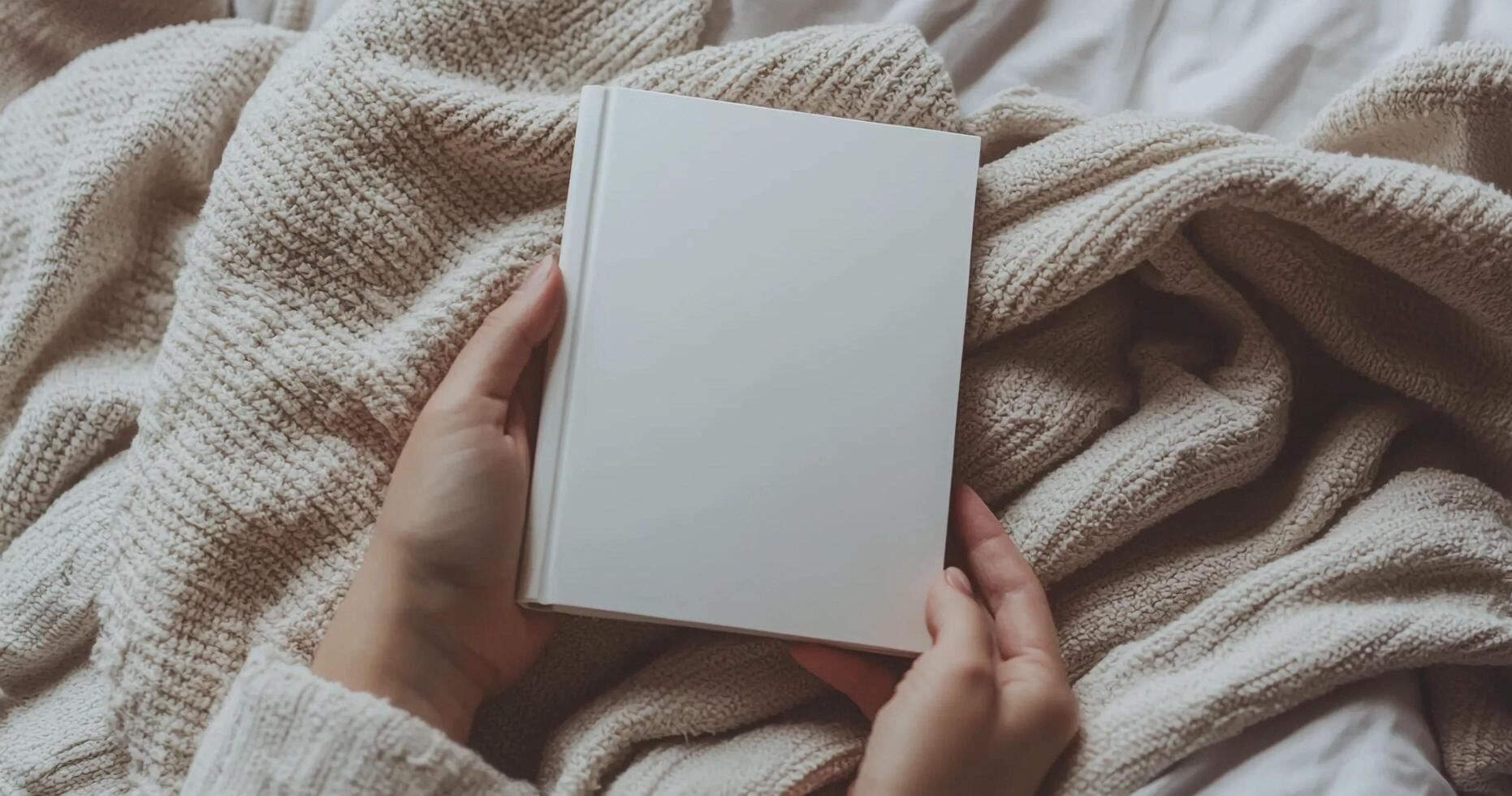 Close-up mockup of woman hands holding a blank white book. Ideal for book cover design, branding, and product display. Minimalist and cozy scene photo