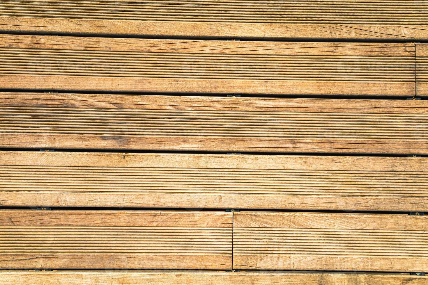 Granular material, solid wood with a structural surface for design textures. Grunge panel with rough coating photo