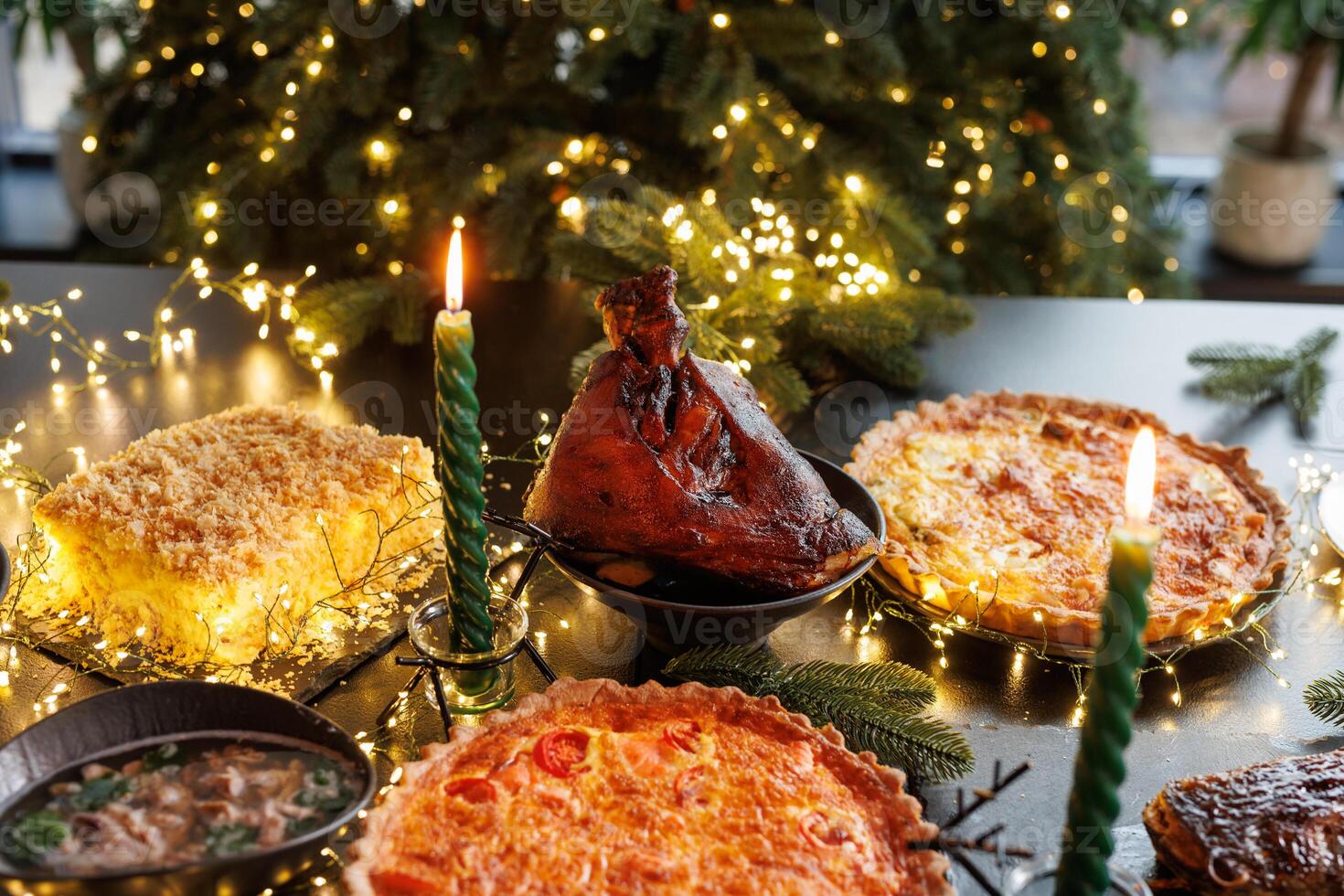 Christmas pork knuckle baked in the oven against the background of a Christmas tree and Christmas decorations photo