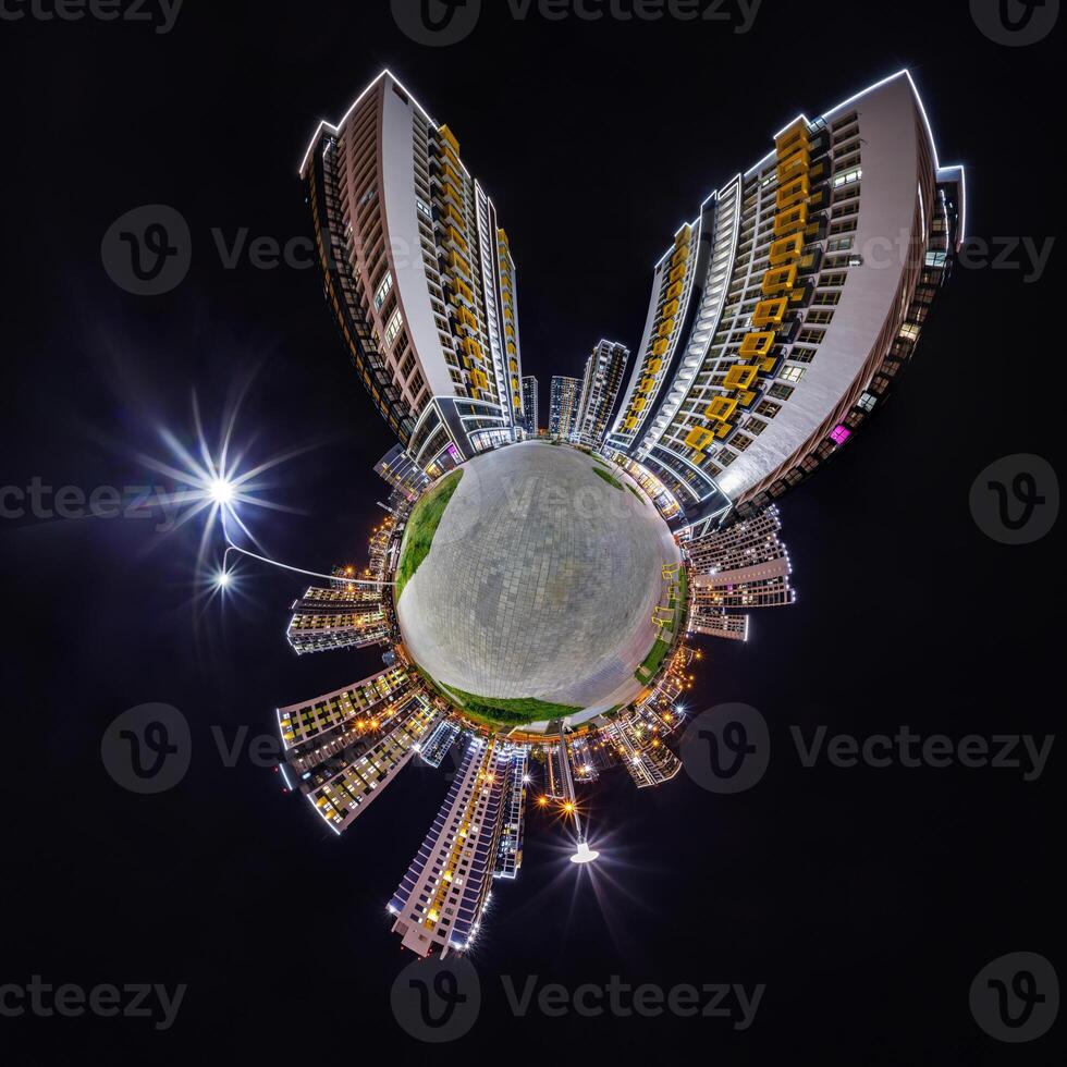 abstract swirling tiny planet spherical panorama of multi-storey buildings of skyscrapers of a residential complex in the form of a butterfly, bugs, crabs in night sky photo