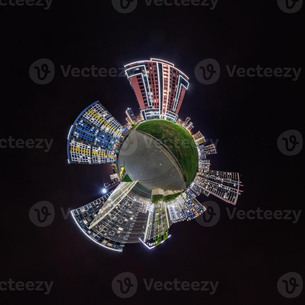abstract swirling tiny planet spherical panorama of multi-storey buildings of skyscrapers of a residential complex in the form of a butterfly, bugs, crabs in night sky photo