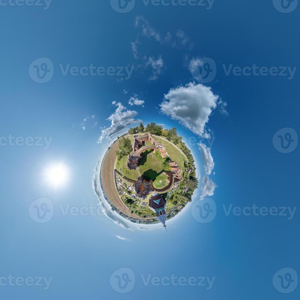 simple little tiny planet without buildings in blue sky with sun and beautiful clouds. Transformation of spherical panorama 360 degrees. Spherical abstract aerial view. Curvature of space. photo