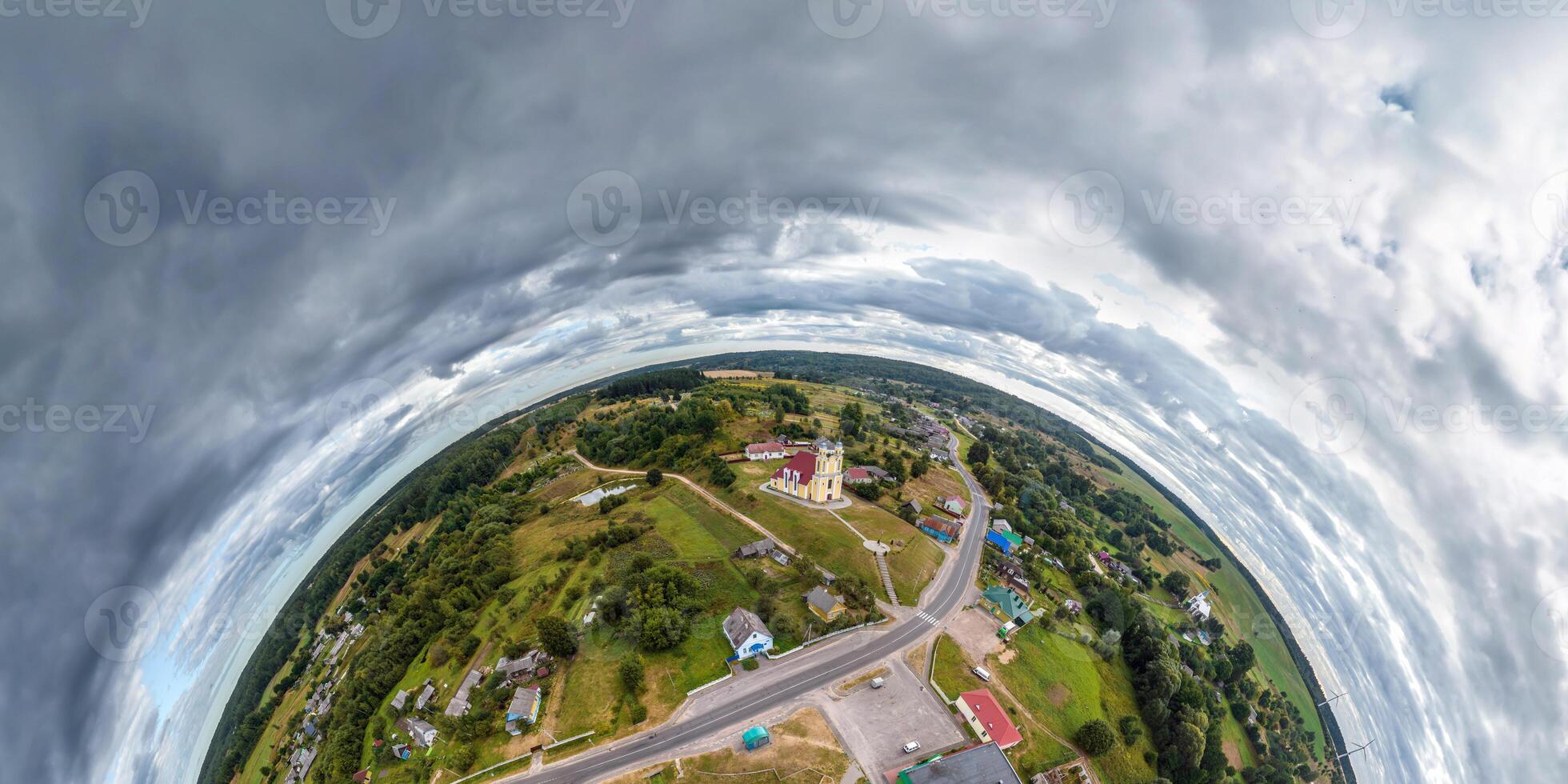 simple little tiny planet without buildings in blue sky with sun and beautiful clouds. Transformation of spherical panorama 360 degrees. Spherical abstract aerial view. Curvature of space. photo