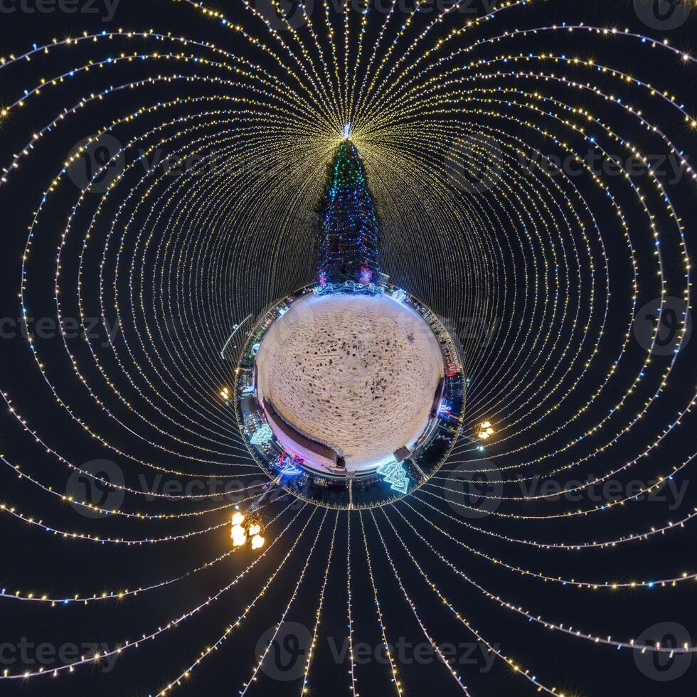 new year tiny planet with Christmas tree. Spherical aerial 360 panorama night view on festive square with illumination in form of tent photo