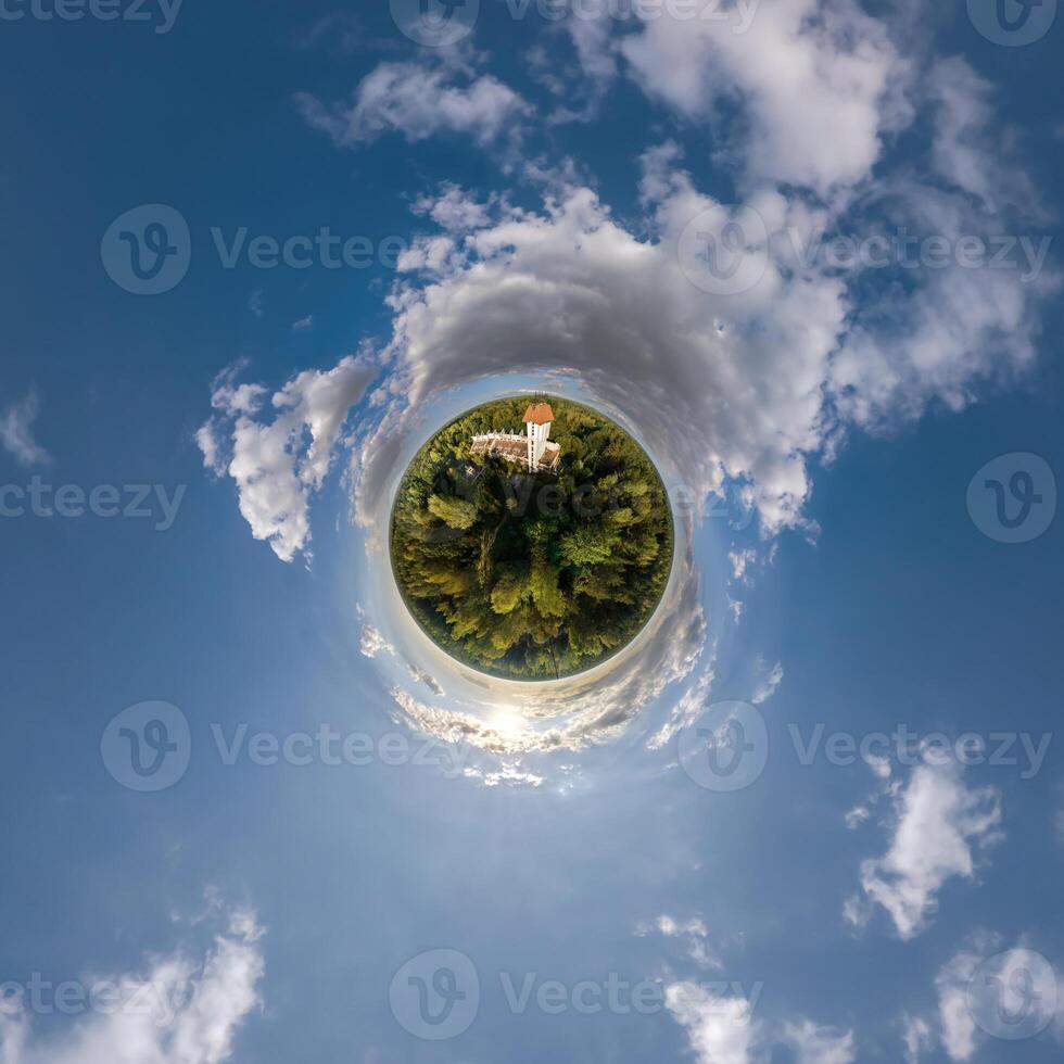 simple little tiny planet without buildings in blue sky with sun and beautiful clouds. Transformation of spherical panorama 360 degrees. Spherical abstract aerial view. Curvature of space. photo