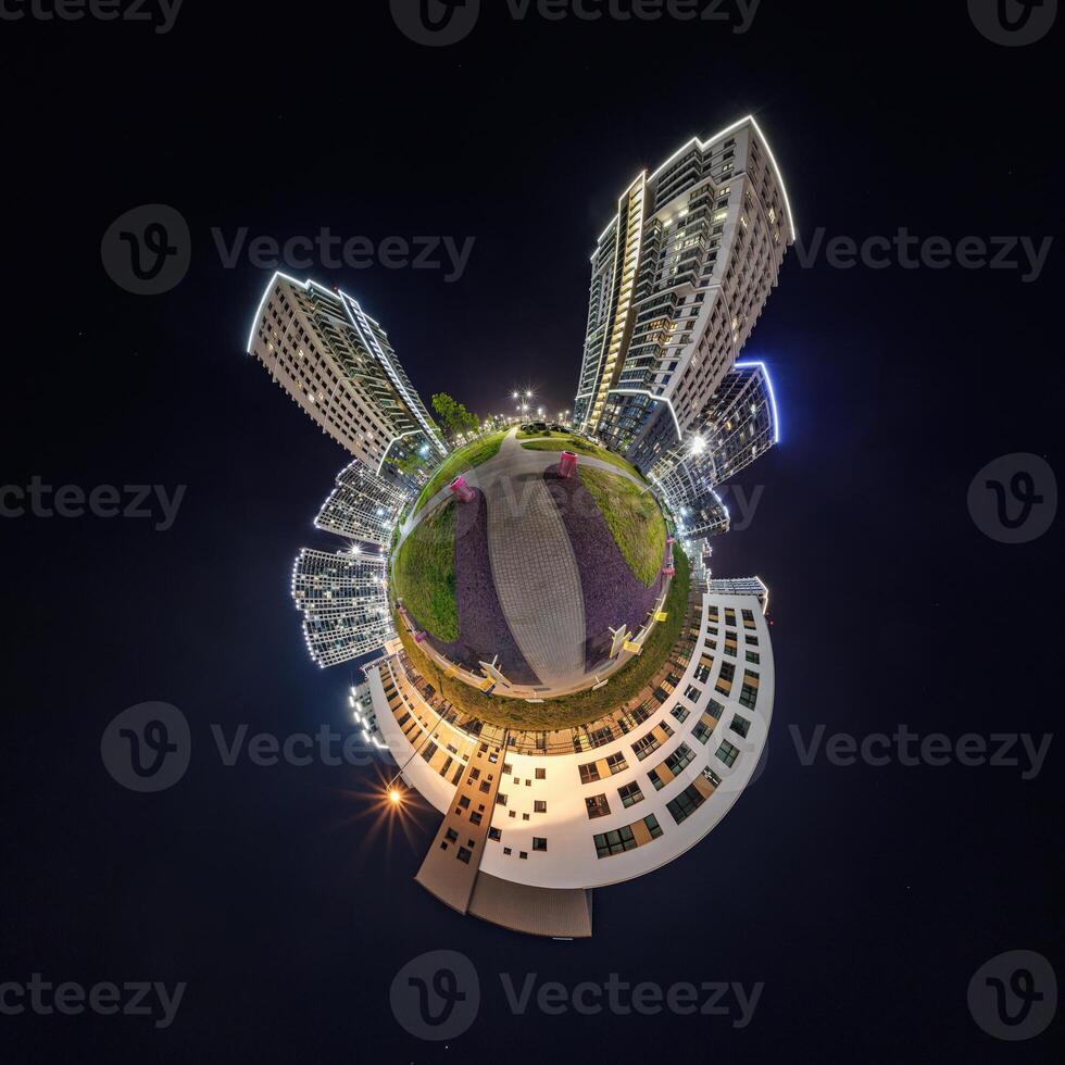 abstract swirling tiny planet spherical panorama of multi-storey buildings of skyscrapers of a residential complex in the form of a butterfly, bugs, crabs in night sky photo