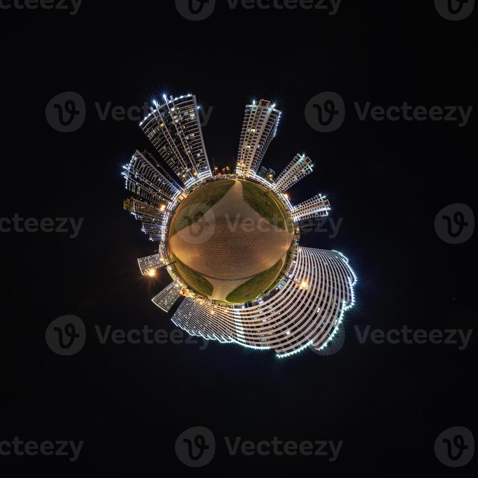 abstract swirling tiny planet spherical panorama of multi-storey buildings of skyscrapers of a residential complex in the form of a butterfly, bugs, crabs in night sky photo