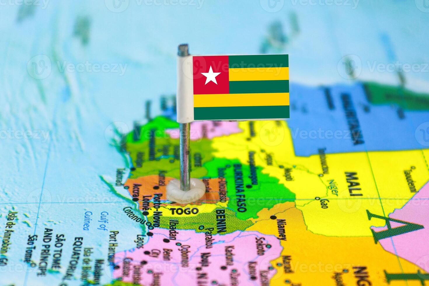 Togo Flag Over World Map, Selectiove Focus photo