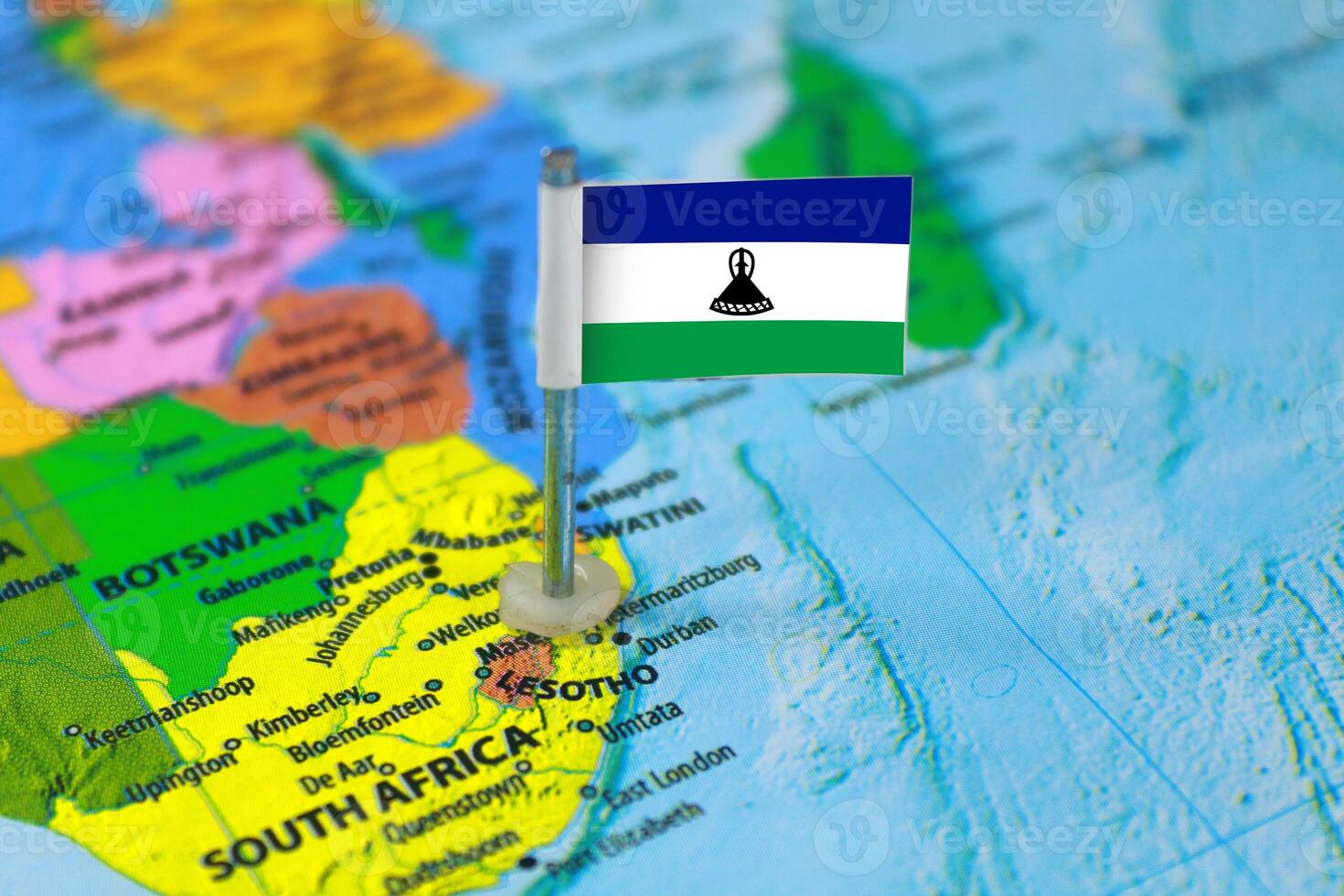 Lesotho Flag Over World Map, Closeup view photo
