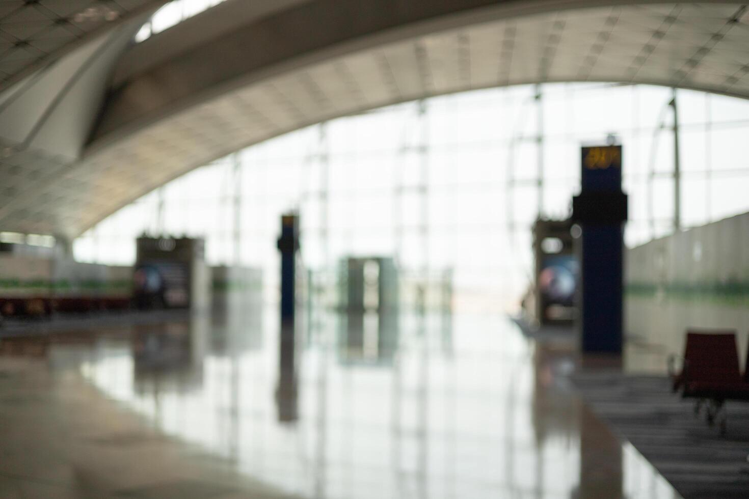 Empty the terminal at the airport boarding gate. airport departure hall for travel and transportation concept. Blur background. photo