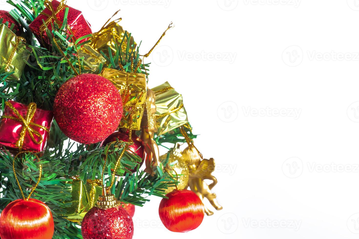 A christmas tree with ornaments and presents photo
