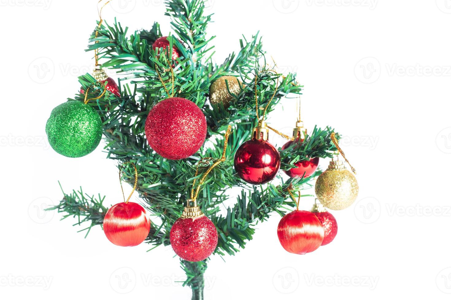 A small christmas tree with ornaments on it photo