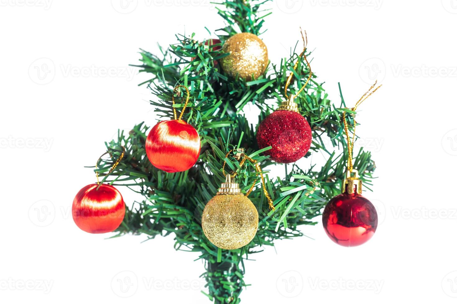 A small christmas tree with ornaments on it photo