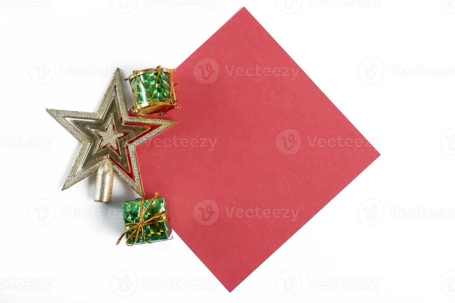 A red paper with a star and gift boxes on it photo