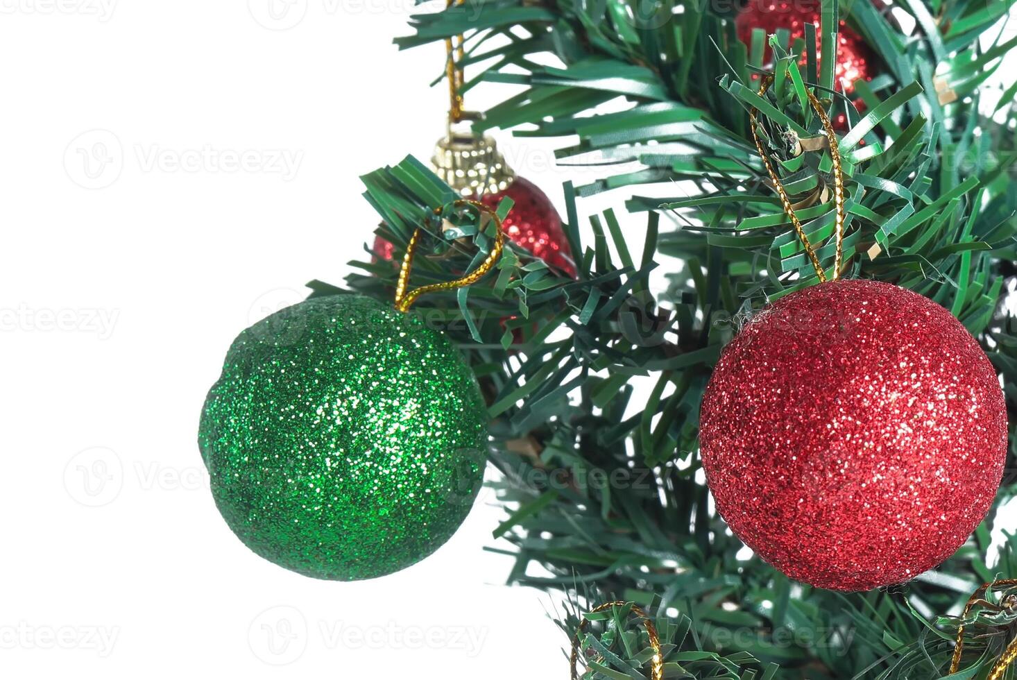 A green and red christmas ornament on a tree photo