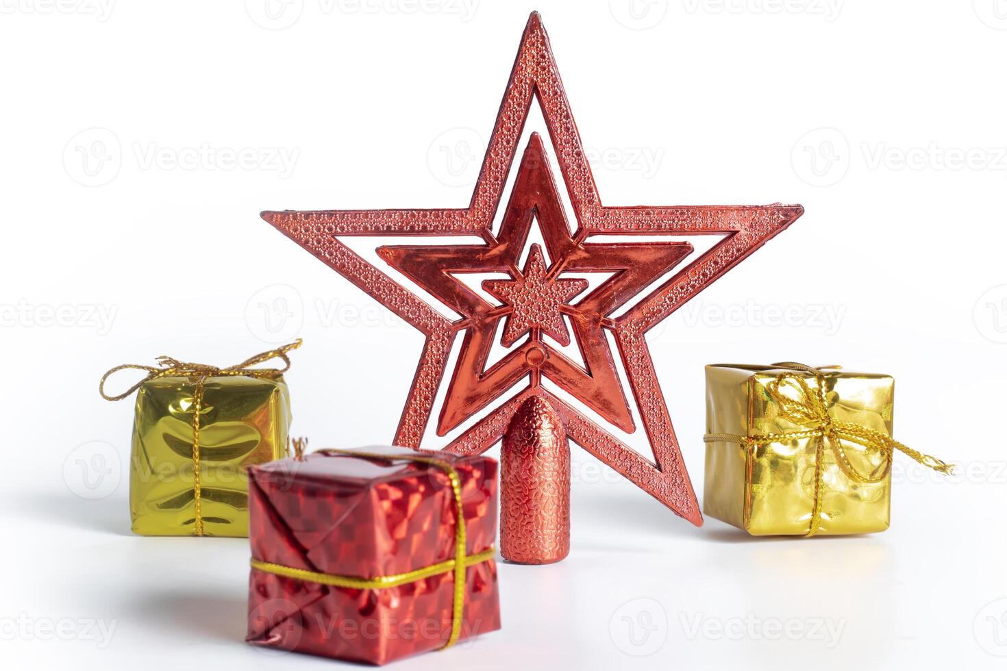 Festive Christmas star decoration with wrapped gifts on white background photo