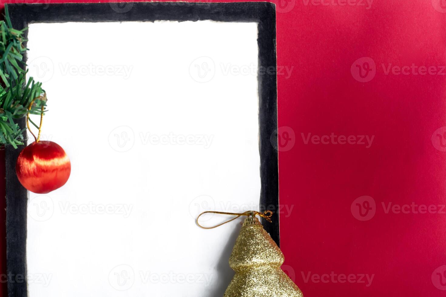 Christmas tree and christmas decorations on a red background photo