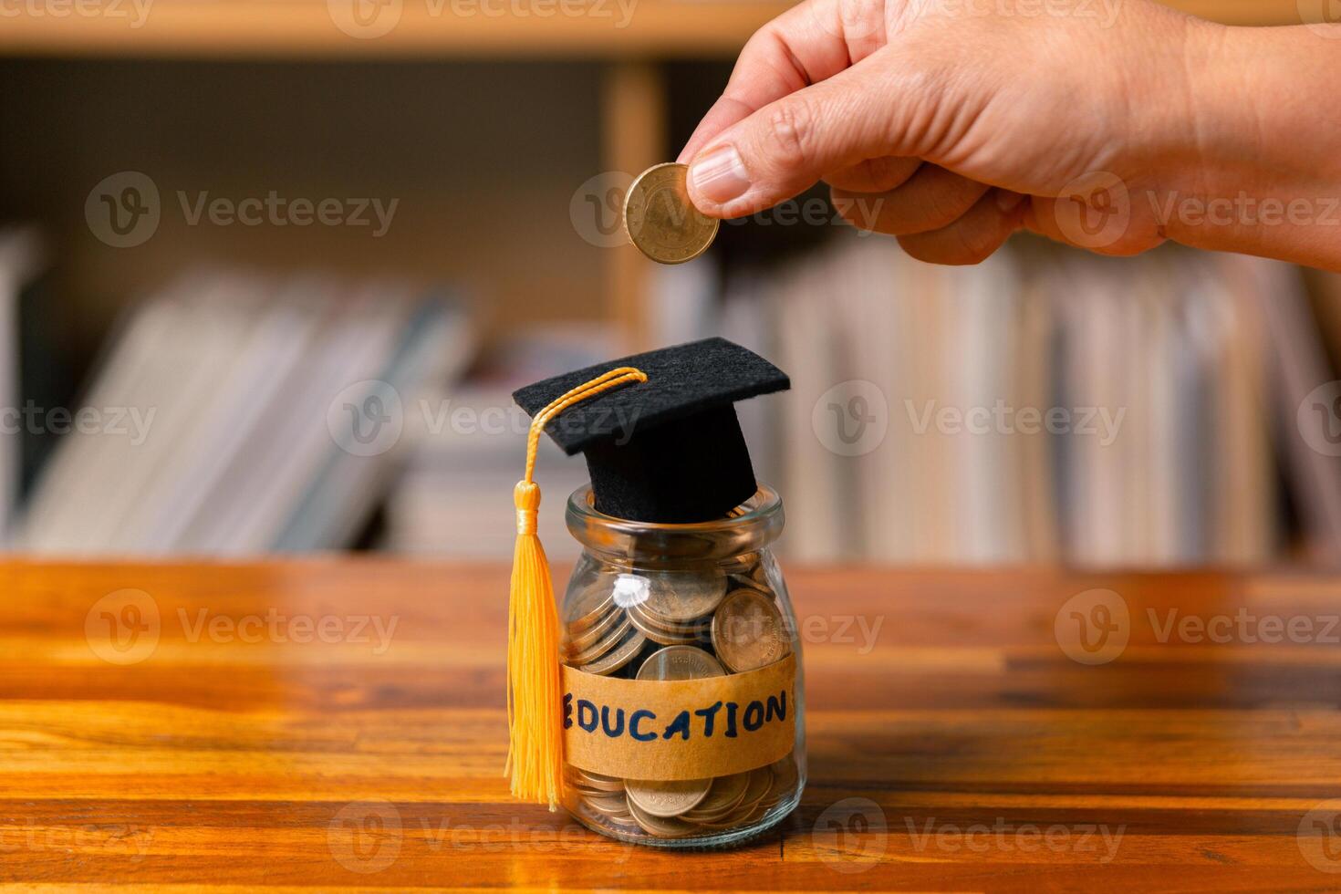 Planning for education abroad requires budgeting money wisely, saving coins, and focusing on future, as it leads to personal growth, cognitive development, and successful graduation as student. photo