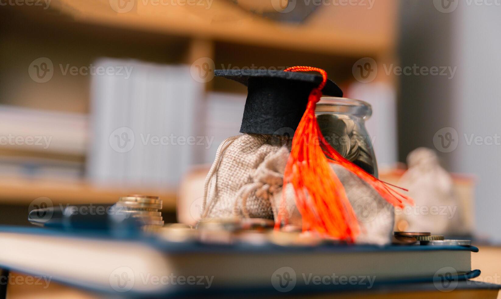 Planning for education abroad involves saving money and making wise investments in finance, which can lead to graduation success, future wealth, cognitive growth, and well-managed budget. hat, idea photo