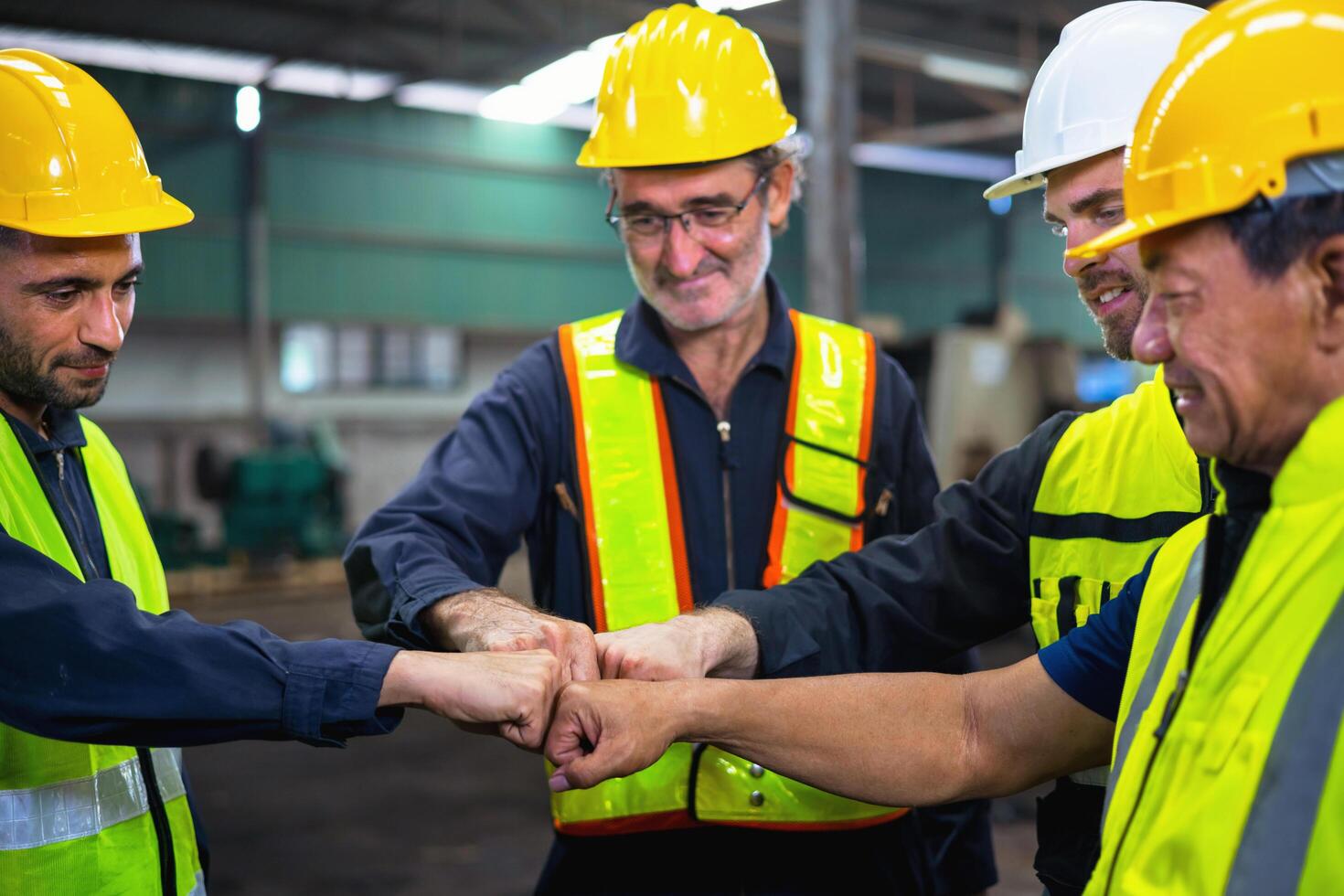 group of construction workers are shaking hands photo