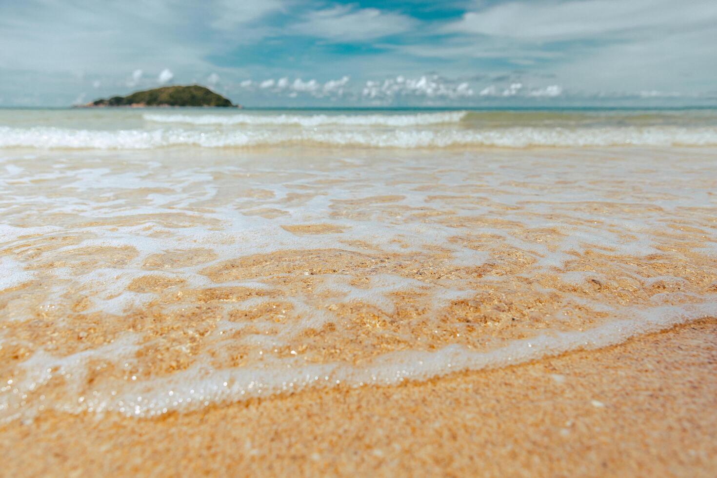ocean is calm and the water is a light blue color photo