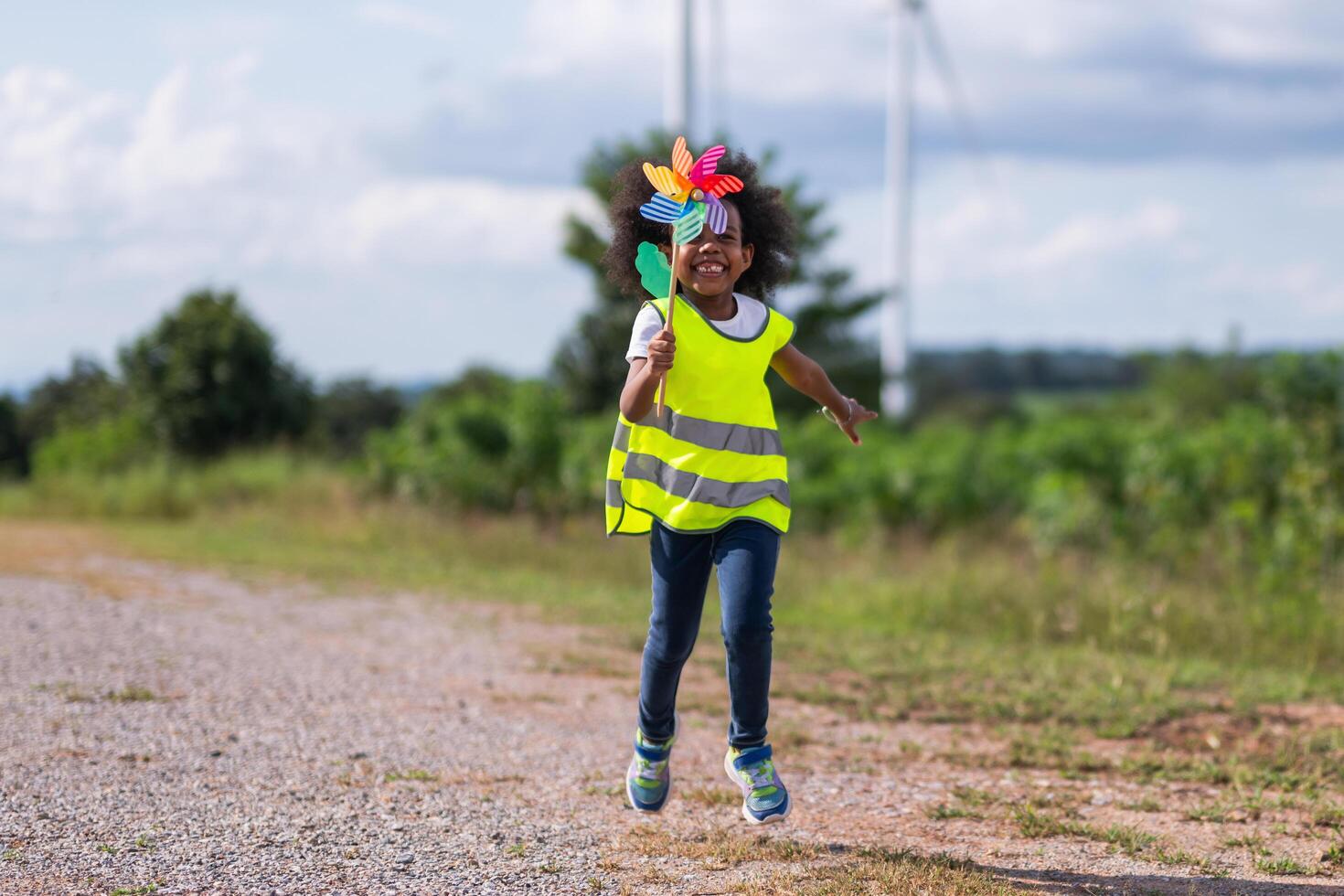 young girl is running with a flower in her hand photo