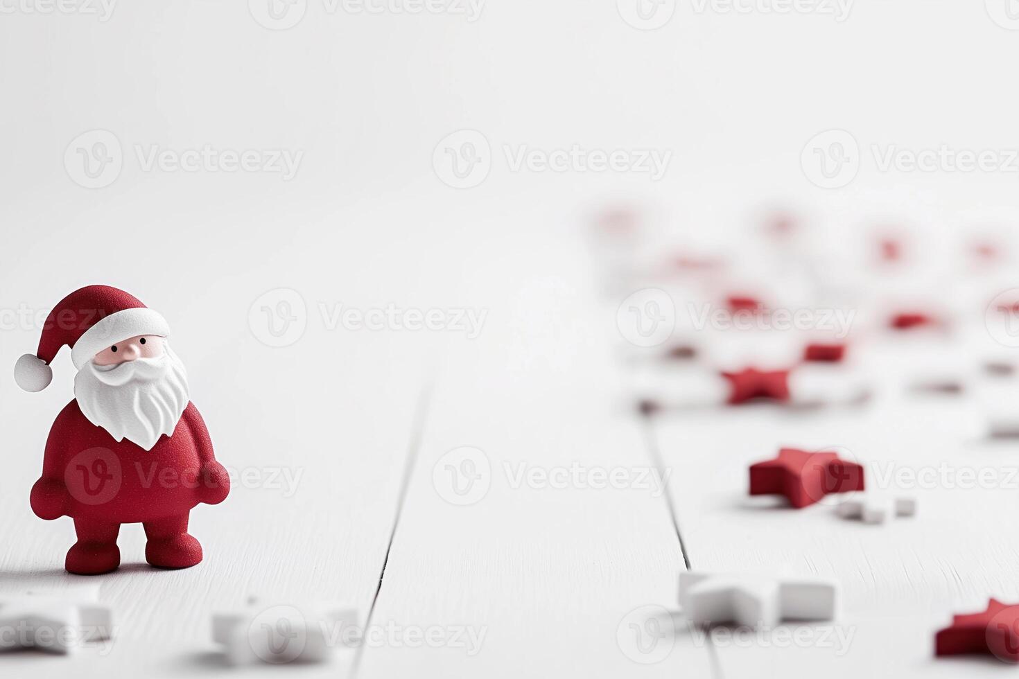 A small Santa Claus figurine stands on a white surface, surrounded by scattered red and white star-shaped decorations, creating a festive and minimalist holiday scene photo