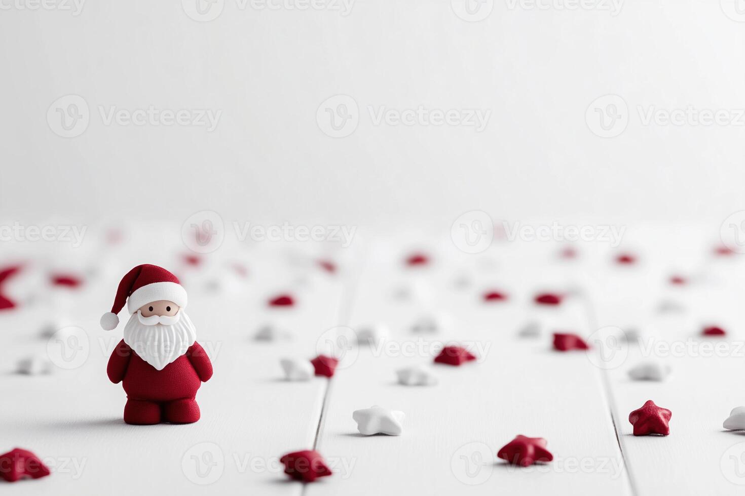 A small Santa Claus figurine stands on a white surface, surrounded by scattered red and white star-shaped decorations, creating a festive and minimalist holiday scene photo