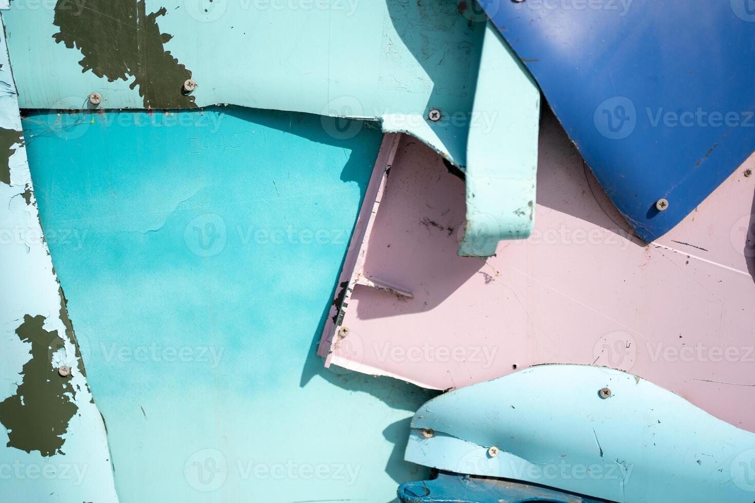Metal sheets nailed on each other to create and wall like structure photo