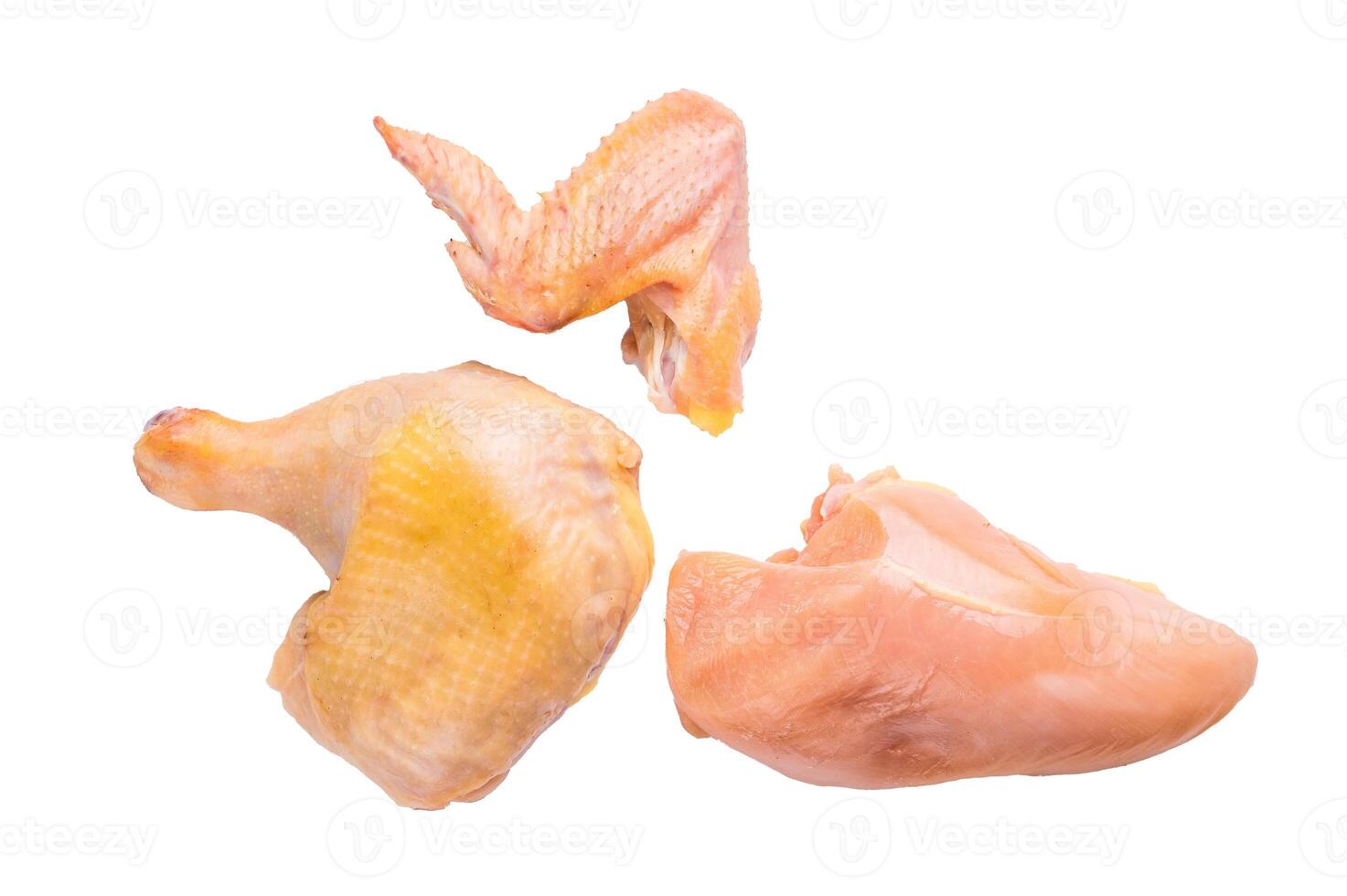 Raw chicken parts, including a wing, thigh, and breast, from an eco farm, isolated on white background photo