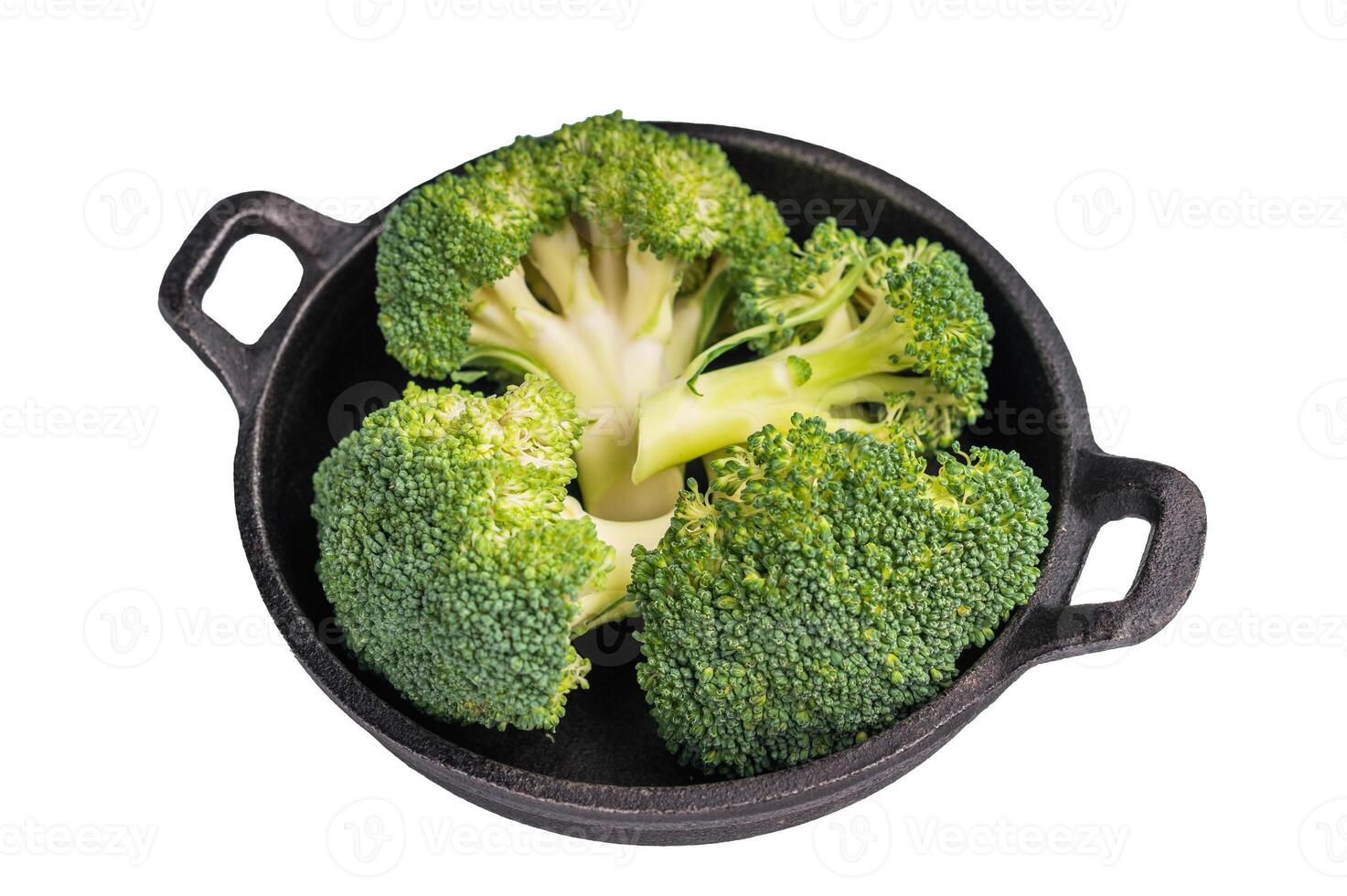 Fresh raw broccoli pieces in a skillet isolated on white background. top view photo