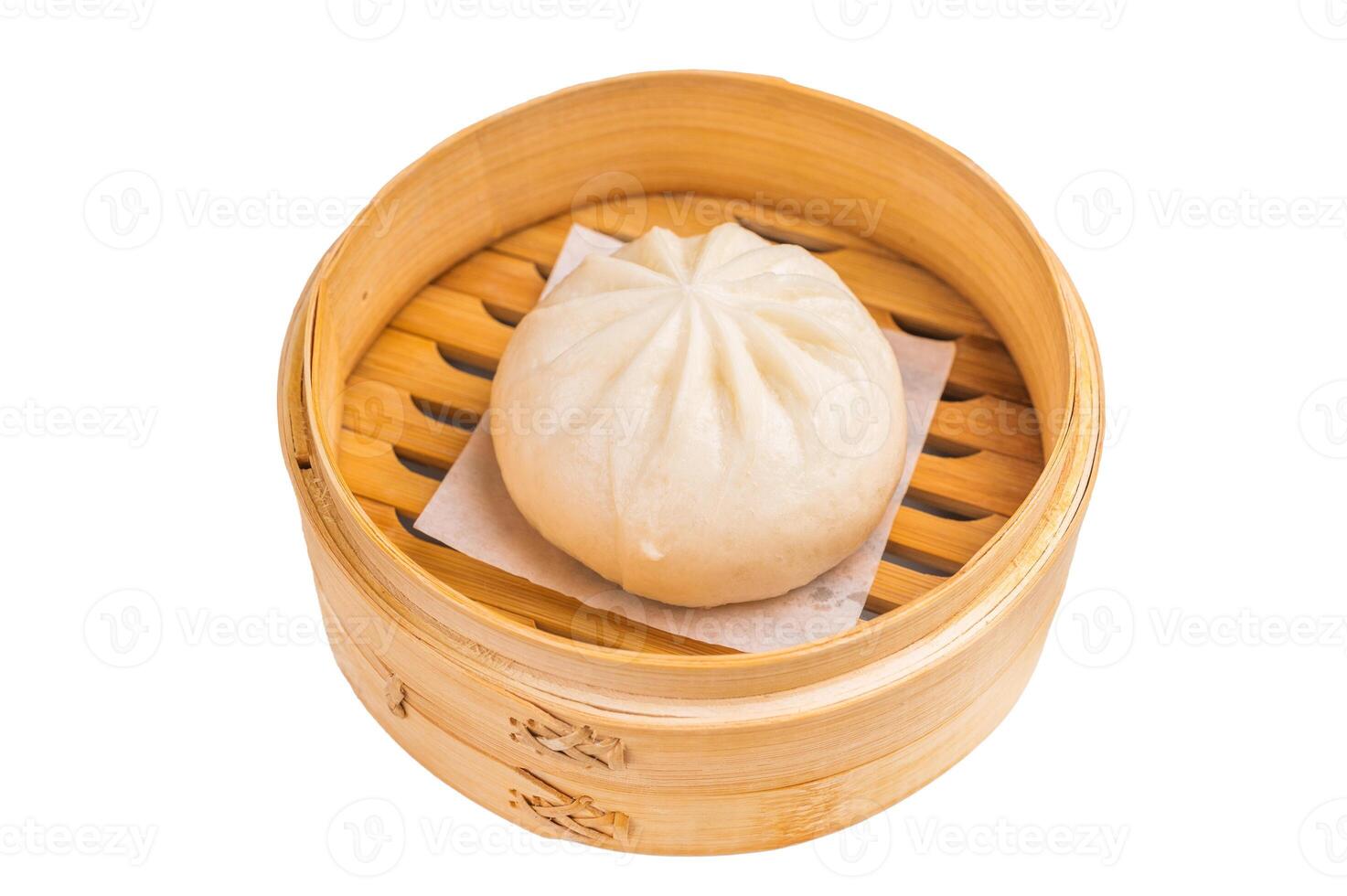 Chinese Bao or Baozi bun with meat in bamboo steamer isolated on white background. top view photo