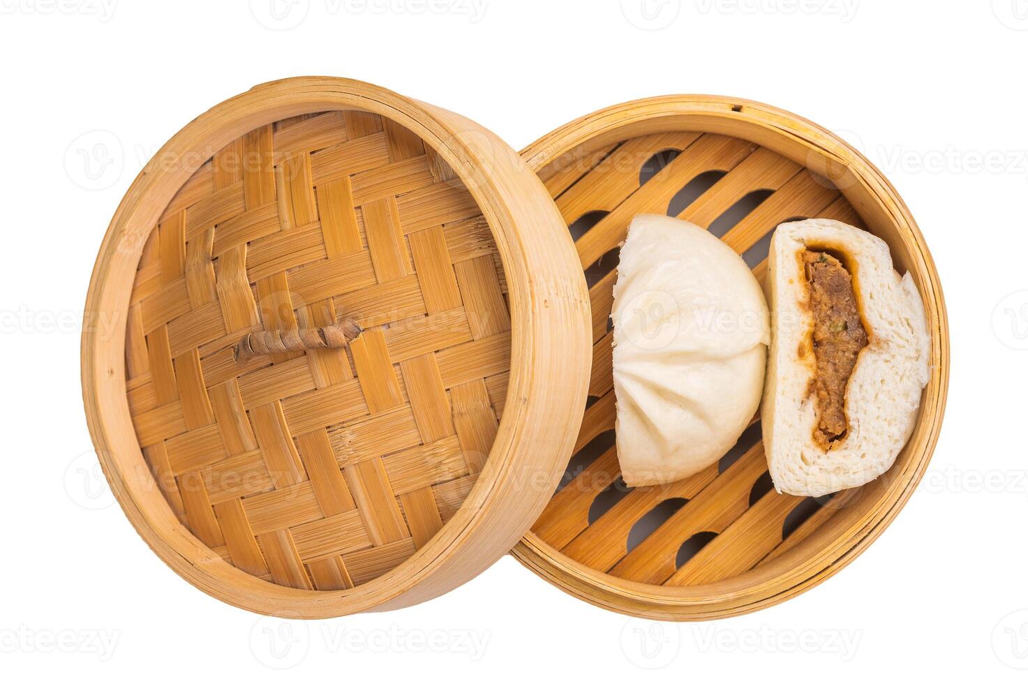 Chinese Steamed Bao bun with pork meat in bamboo steamer isolated on white background. top view photo